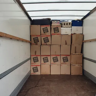 Carboard boxes in the back of a van