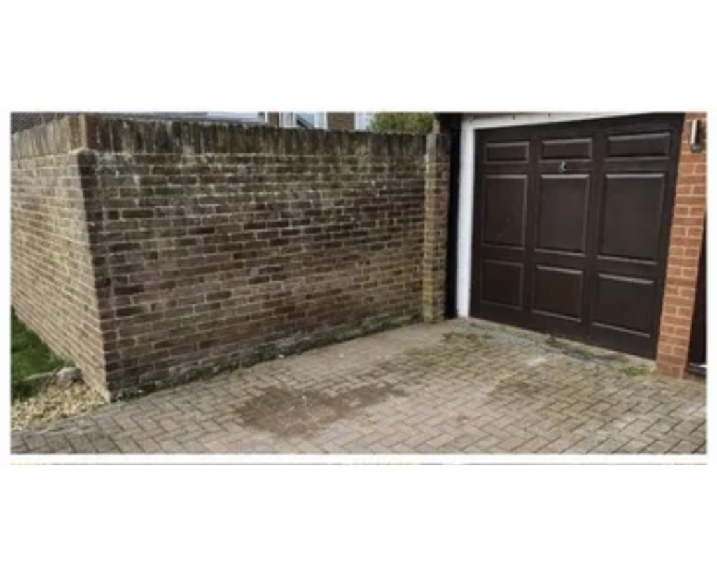 a brick wall and a garage