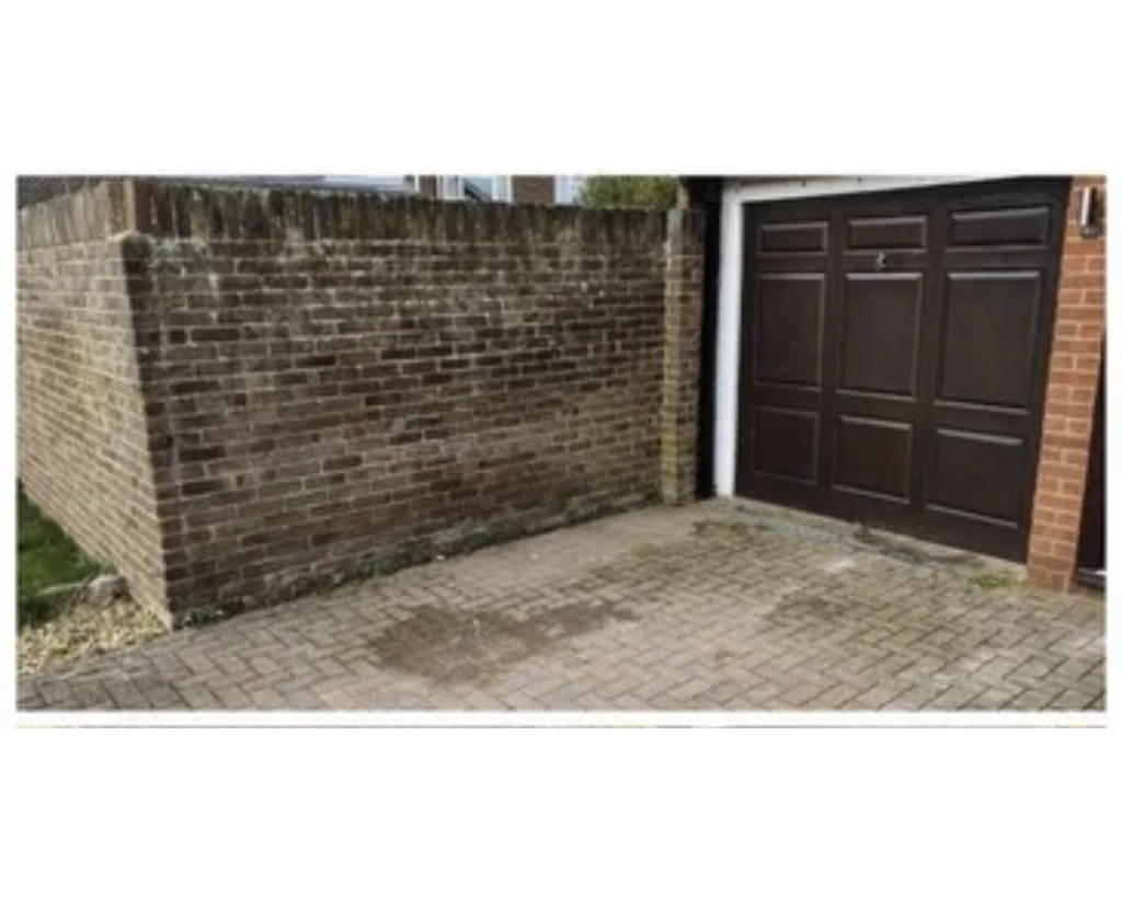 a brick wall and a garage